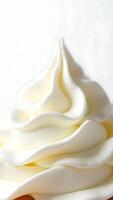 Closeup view of smooth whipped cream topping with detailed texture on dessert plate photo