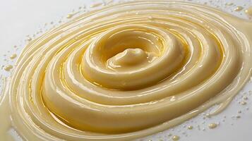Closeup view of a smooth swirl of creamy texture on a flat surface photo