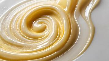 Closeup view of a delicate swirl of creamy texture against a plain surface photo