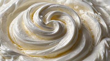 Closeup view of creamy whipped topping showcasing smooth texture and swirl pattern photo