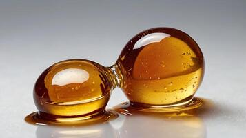 Closeup of maple syrup droplets demonstrating texture and color photo