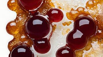 Closeup of grape jelly spread showcasing texture and color variations on a surface photo