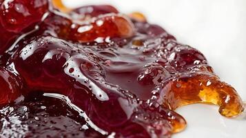 Extreme closeup of smooth grape jelly spread showcasing rich texture and color photo