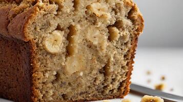 Closeup view of a moist slice of banana bread showcasing its texture and flavor photo