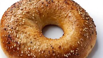 Closeup view of a toasted bagel topped with sesame seeds showcasing its texture photo