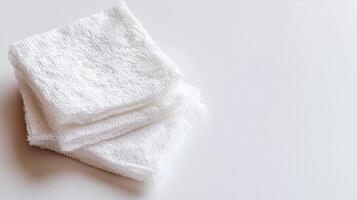 Safety emergency concept. Three stacked white towels on a clean surface. photo
