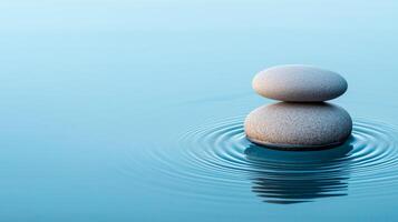 Beginning journey concept. Balanced stones on water surface, creating a tranquil and serene atmosphere. photo