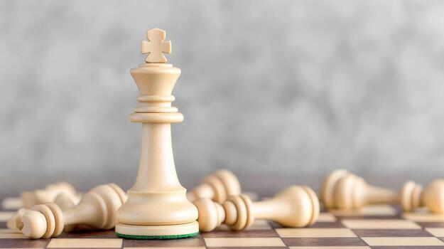 Chess pieces on a board, with a prominent king in focus and others scattered around. photo