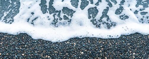 Beginning journey concept. Waves washing over a pebbled beach, creating a serene coastal scene. photo