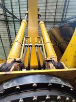 Close-Up View of Excavator Engine and Hydraulic Hoses with Metal Details photo