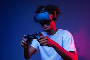 A man wearing a vr headset and holding a game controller photo