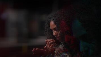 A Contemplative Moment in a Dimly Lit Space, enveloped in hushed tranquility and serene beauty video