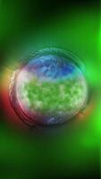 A voluminous green planet with a metallic tint rotates in outer space video