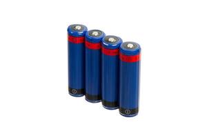 Four blue cylindrical batteries with red labels, standing upright in a row on a white back photo