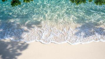 A serene beach scene featuring gentle waves lapping against a sandy shore, complemented by lush greenery overhead, inviting relaxation and escape into nature's beauty. photo