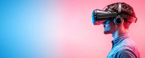 A young man experiences virtual reality with a sleek headset, immersed in a vibrant blue and pink background, showcasing the exciting world of modern technology. photo