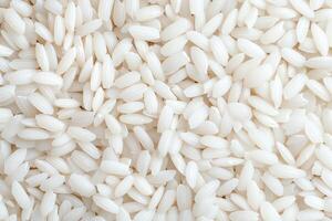 A close-up image of polished white rice grains showcasing their smooth, glossy texture. Perfect for culinary themes and food-related projects, emphasizing freshness and quality. photo