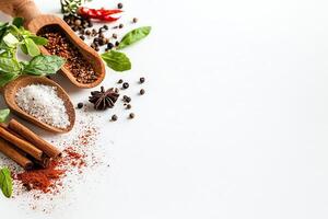 An assortment of vibrant spices and herbs displayed on a white background. Enhanced flavors with fresh ingredients like chili, mint, and cinnamon invite creativity in cooking. photo