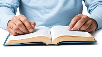 A person reading a book with focused attention. The open pages reveal text, symbolizing knowledge and learning. Ideal for themes of education, hobbies, and personal development. photo