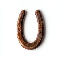 A rustic horseshoe resting on a light background, symbolizing good luck and prosperity. Perfect for themes of tradition and rural life in various creative projects. photo