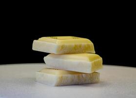 Stack of White Chocolate Squares on a Dark Background photo