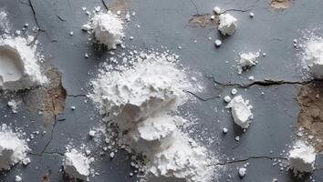 White Powder Spread Over Textured Grey Surface Ideal for Backgrounds and Copy Space Use in Design Projects. photo