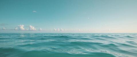A view of the ocean from above with clouds in the sky photo