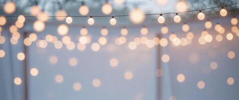A string of lights hanging from a tent photo