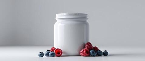A bottle of vitamins and berries on a table photo