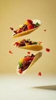 Levitating tortillas filled with seasoned meat and fresh vegetables create a playful and appetizing culinary display photo