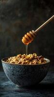 Rustic bowl of oatmeal topped with walnuts and honey drizzling from wooden dipper in a cozy kitchen setting photo