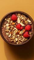 Berry granola bowl with almond flakes for a healthy breakfast or snack option prepared in a warm kitchen setting photo