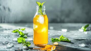 Refreshing turmeric lemonade with ice and mint leaves in a vibrant setting for a healthy drink option photo