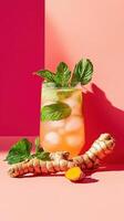 Lemonade infused with freshly grated turmeric and mint, presented against a vibrant background photo