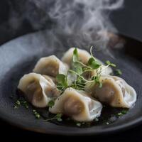 Delicious beef dumplings with fragrant herbs served on a sleek black plate photo