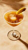 Delightful lemon drop martini served in a stylish glass with a lemon twist and ice on a light backdrop photo