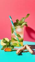Refreshing lemonade with freshly grated turmeric and mint served in a glass on a vibrant background photo