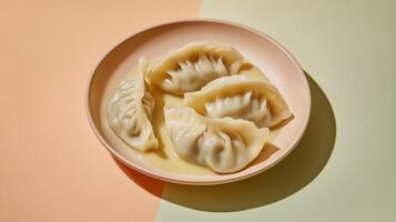 Dumplings artfully displayed in a creamy sauce on a pastel background photo