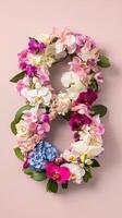 Number 8 made of flowers on pink background photo
