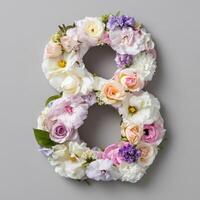 Number 8 made of flowers on gray background photo