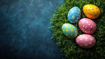 Colorful decorated eggs resting on vibrant grass create a festive atmosphere for spring celebrations and holiday traditions photo