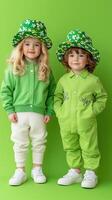 Young boy and girl dressed in vibrant green outfits against a bright background photo