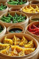 Vibrant assortment of colorful dumplings displayed in bamboo steamers at a lively food market photo