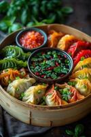 Colorful assortment of vibrant dumplings served with dipping sauces on a wooden steamer basket photo