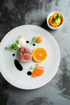 Delightful presentation of tuna and orange showcasing culinary creativity in a minimalist setting photo
