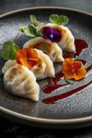 High-end culinary presentation of expertly crafted dumplings adorned with edible flowers and garnished with sauce photo
