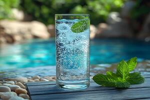 Refreshing Summer Beverage with Mint by a Pool - Perfect for Relaxation photo