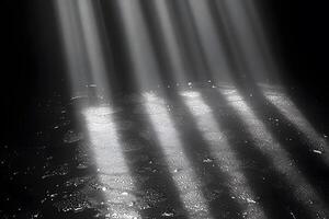 Sunlight Streaming Through Darkness Illuminating Reflective Water Surface photo