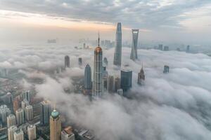 Shanghai Skyline Emerging from a Sea of Clouds at Dawn A Stunning Aerial View of Modern Architecture photo