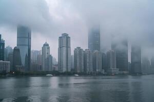 Misty Morning Skyline of Modern City Buildings Along a Calm River photo
